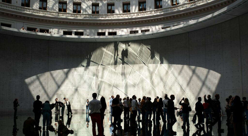 a group of people standing in a building